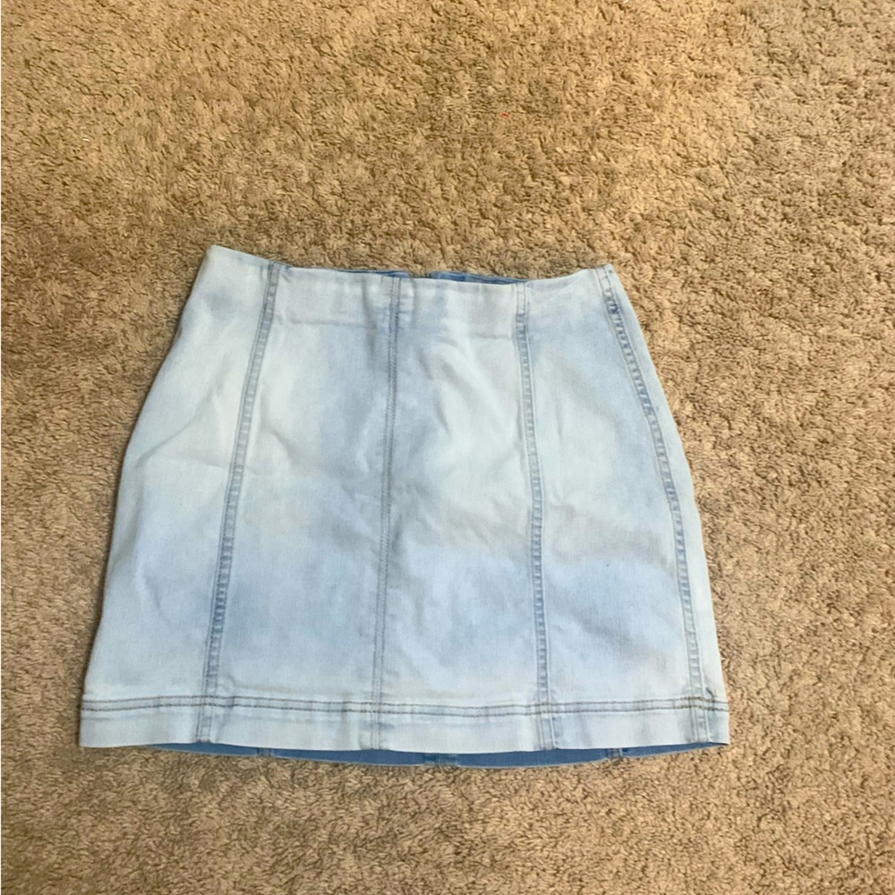 Light wash denim mini skirt.